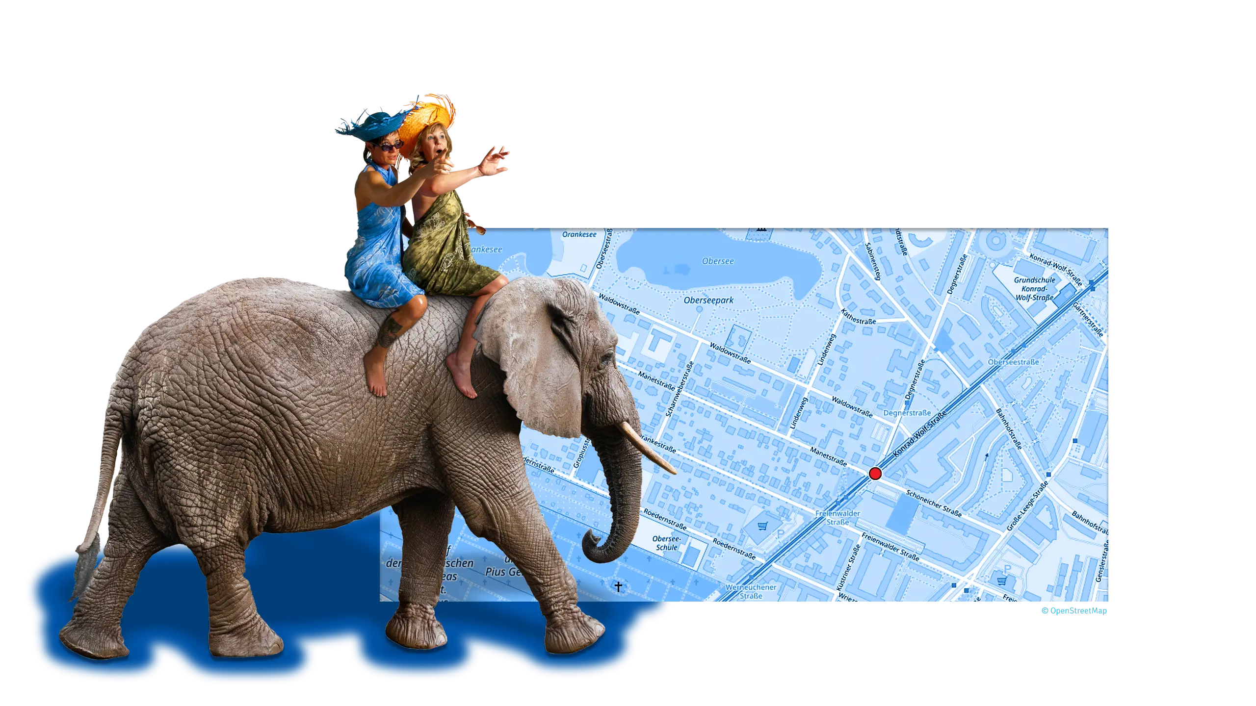 Stadtplan mit Standort des Reisebüros Ferienland und Elefant mit den Inhaberinnen als Blickfang
